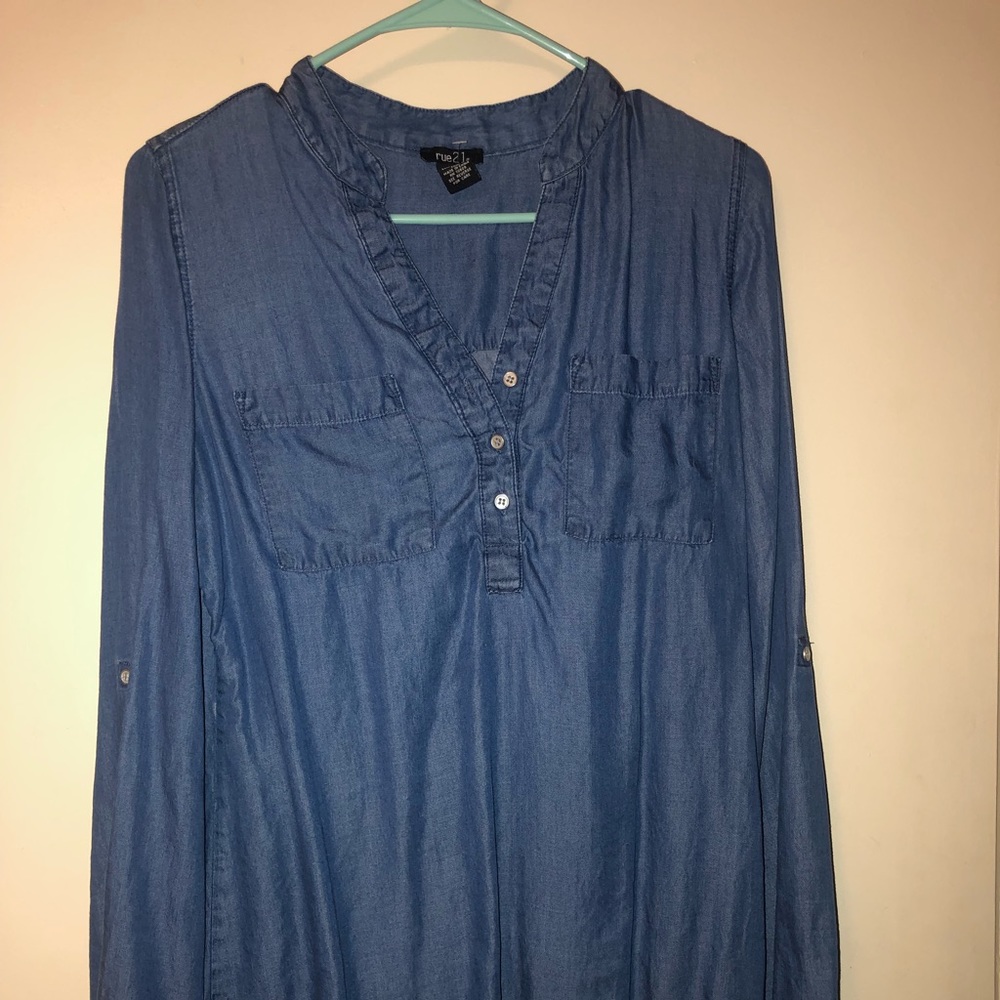 A blue jean button up shirt